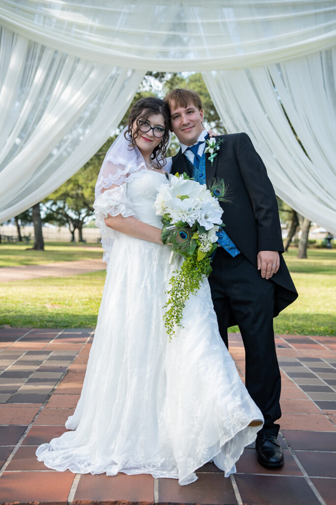 Woman and man at alter after wedding ceremony.