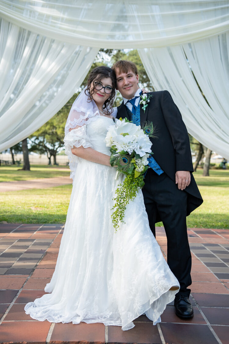 Woman and man at alter after wedding ceremony.