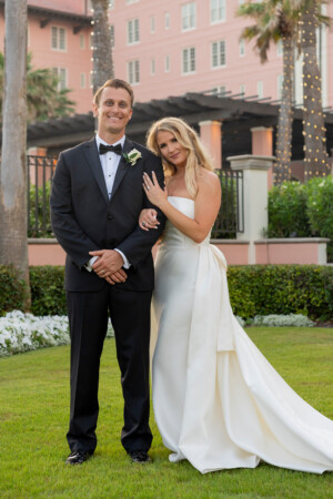 Bride and groom posing together for a romantic outdoor portrait