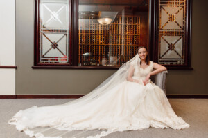 Mary Zug Bridal Session in elegant wedding gown with long veil, capturing a beautiful bridal moment.
